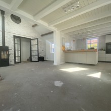 Woonkamer met leefkeuken ondervloer Woonkamer met leefkeuken ondervloer